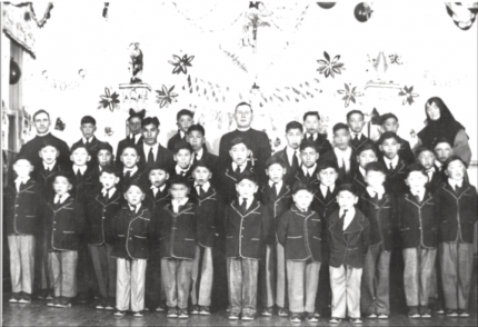 Photograph of a group of boys and staff St. Anne’s Indian Residential School (Fort Albany, Ont.) originally created 1945 —- Credit- Algoma University Archives